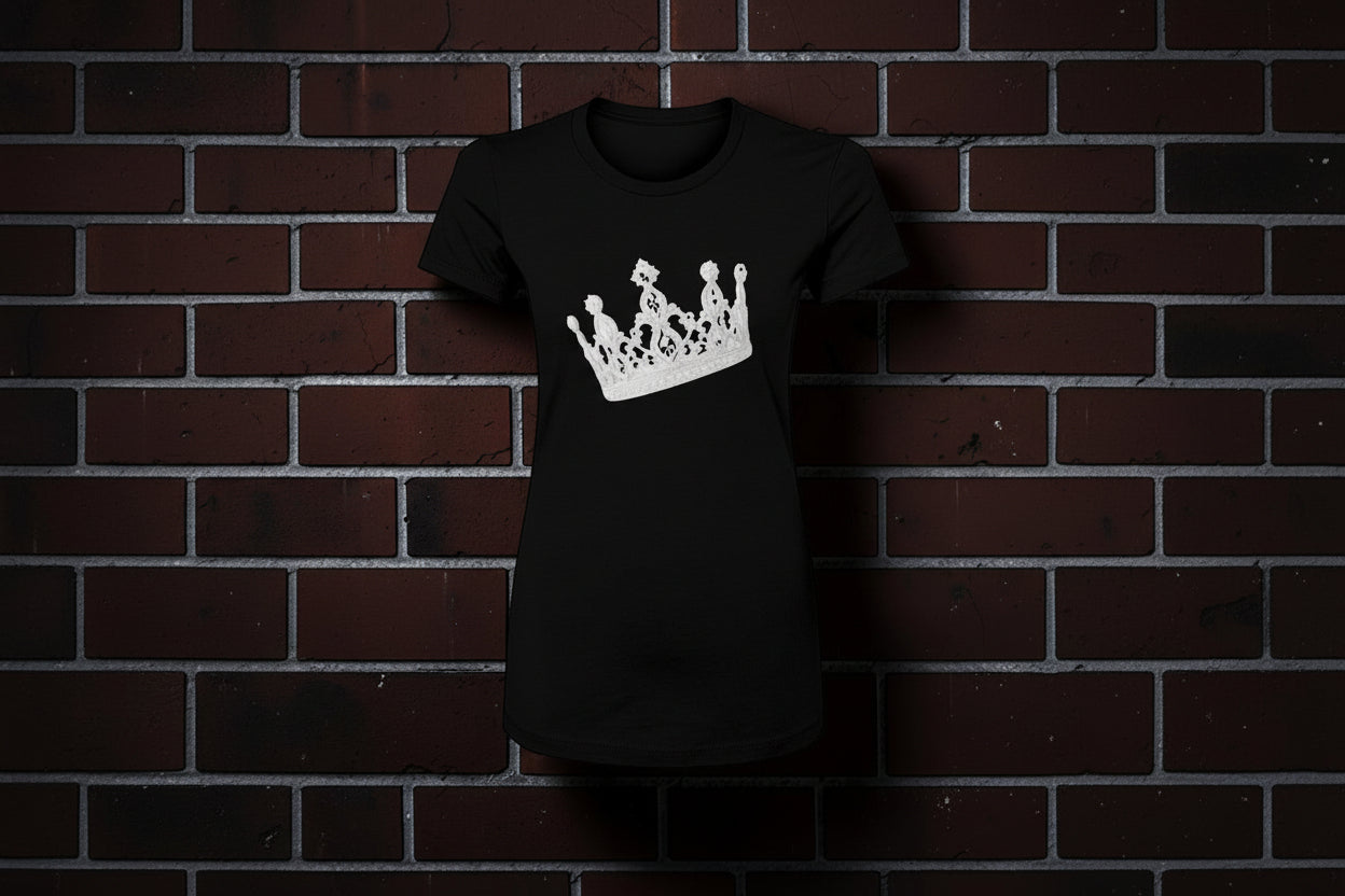 CocoMe Couture black slim-fit cotton graphic tee featuring a white crown design against a brick wall background