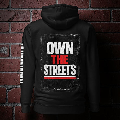 Back view of a black CocoMe Couture premium hoodie featuring a bold Own the Streets graphic print in white and red.