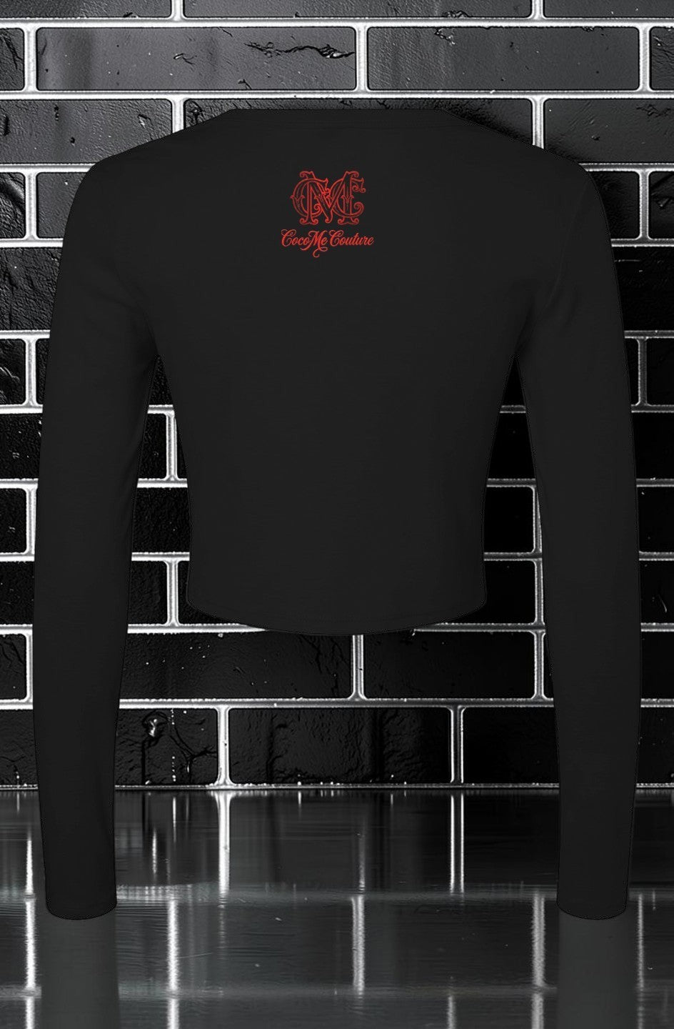 CocoMe Couture black long sleeve micro rib baby tee with red logo on the back against a black brick wall background