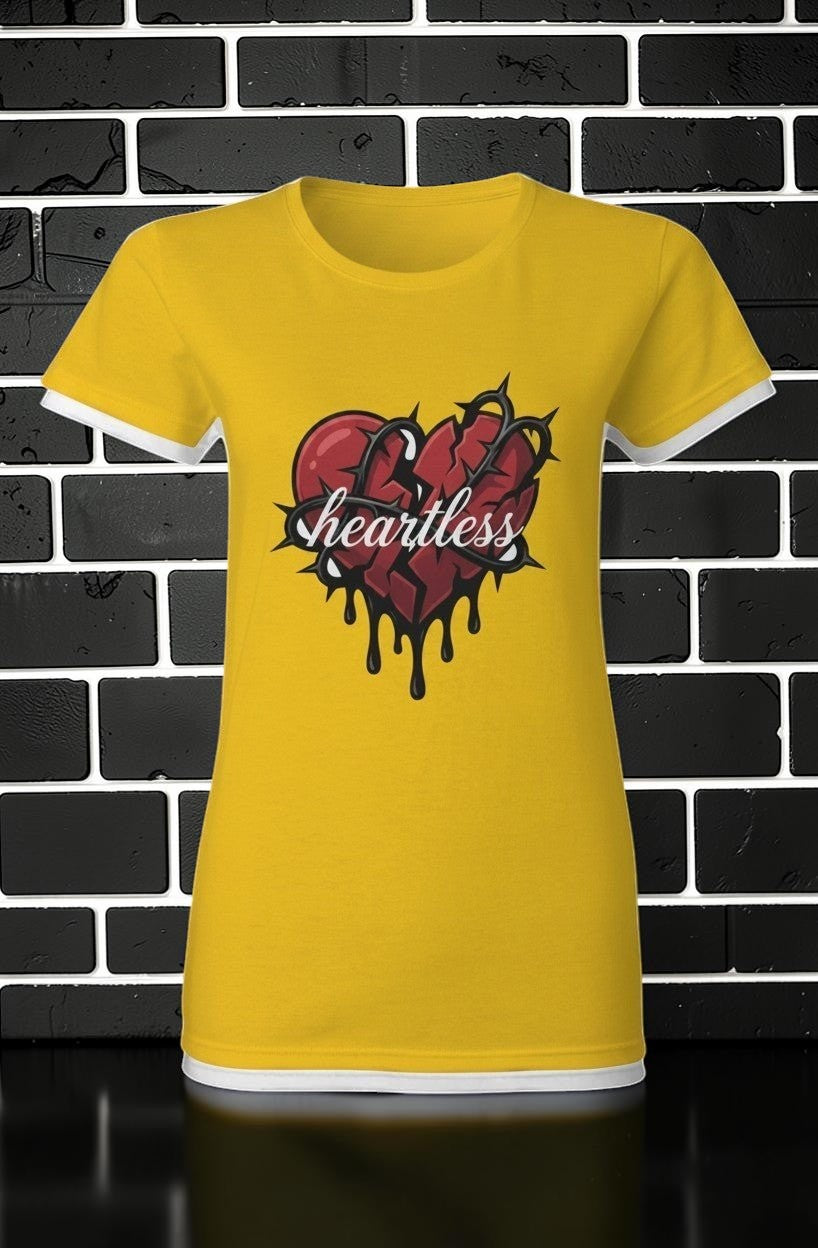 CocoMe Couture gold heavy cotton tee featuring a graphic of a broken heart wrapped in barbed wire with heartless text
