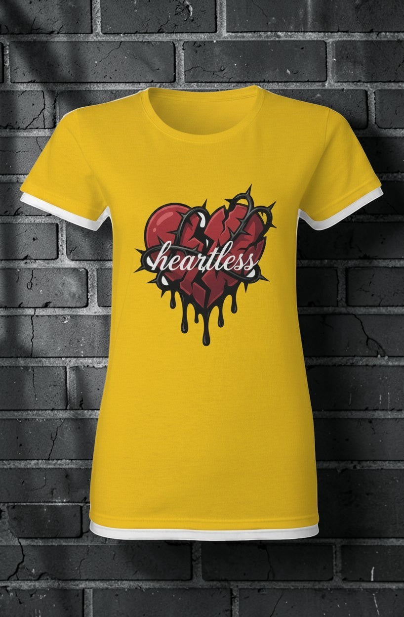 CocoMe Couture gold heavy cotton tee featuring a broken heart graphic with thorns and the word Heartless