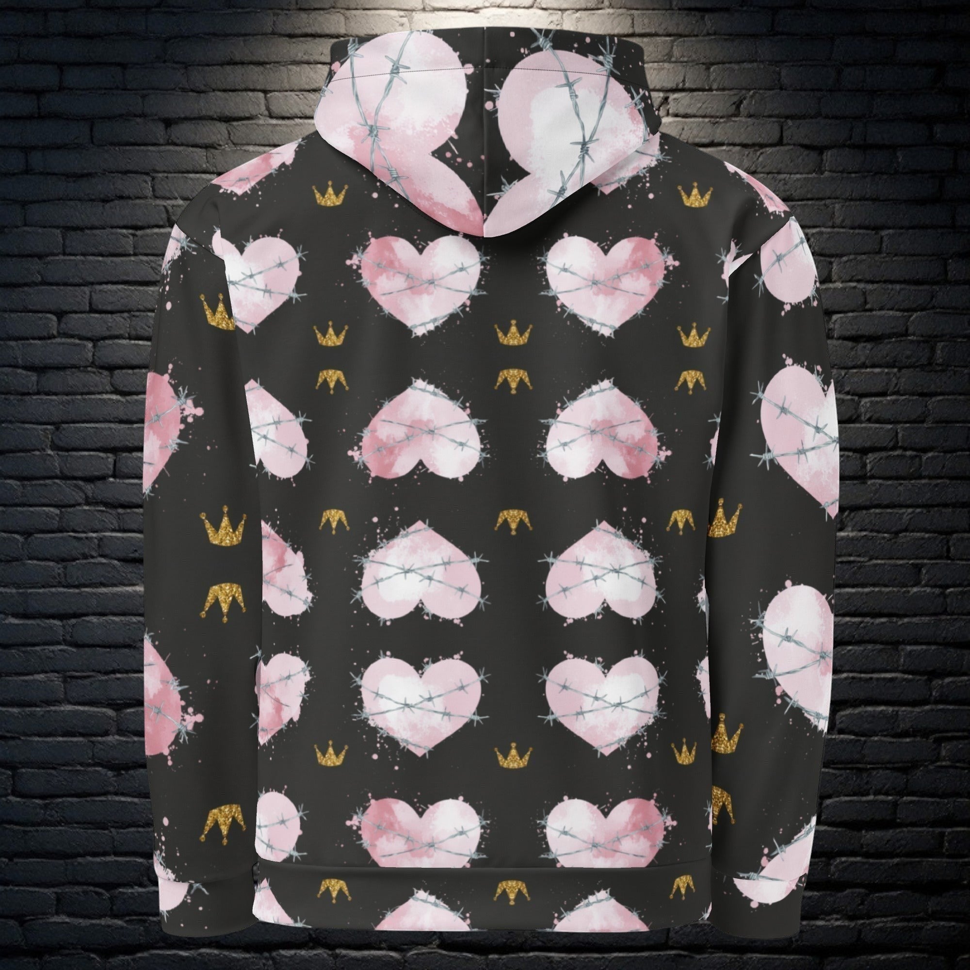 CocoMe Couture Heart of Thorns unisex hoodie with black background, pink heart, barbed wire, and gold crown print.