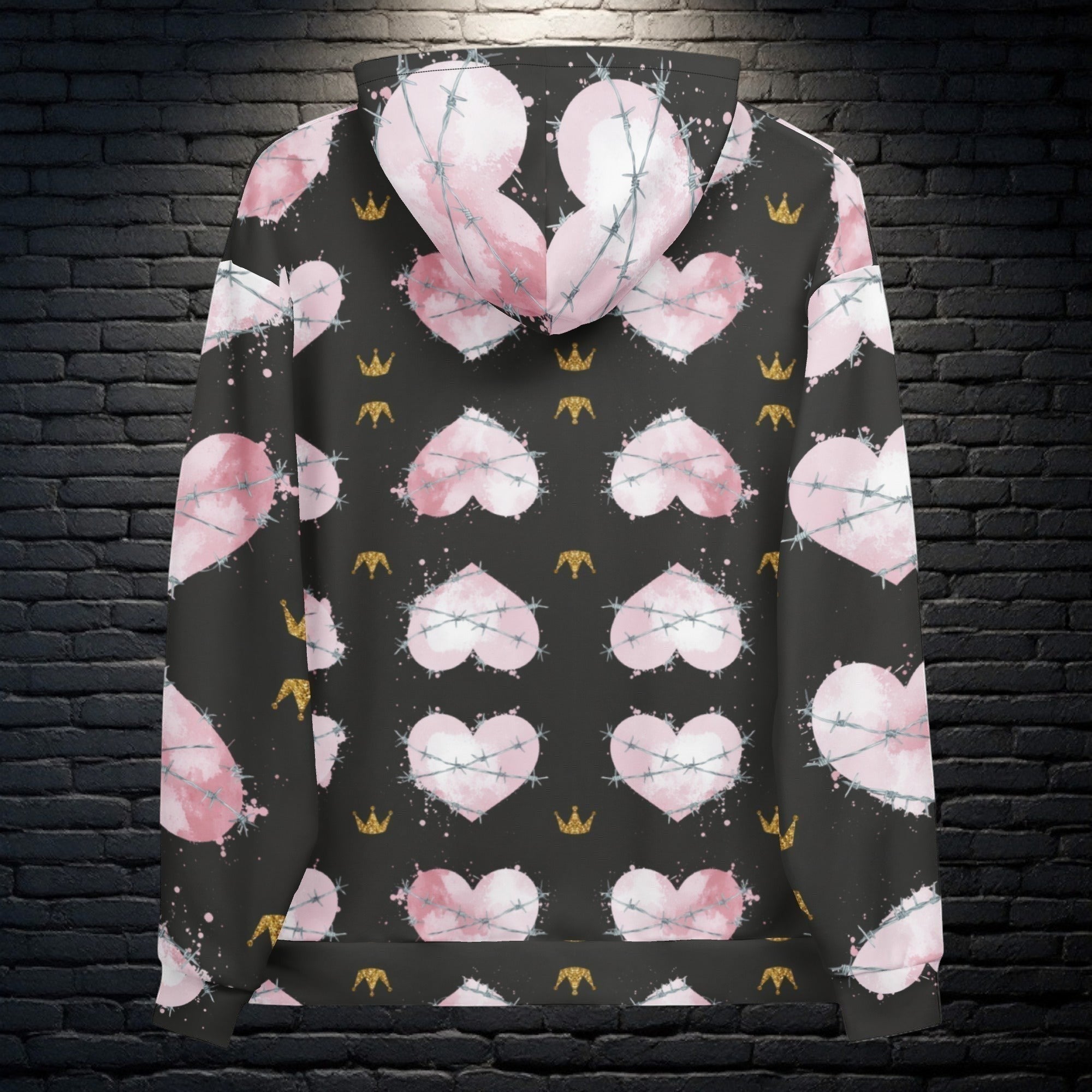 CocoMe Couture Heart of Thorns unisex hoodie with pink heart and barbed wire all-over print on a black background.