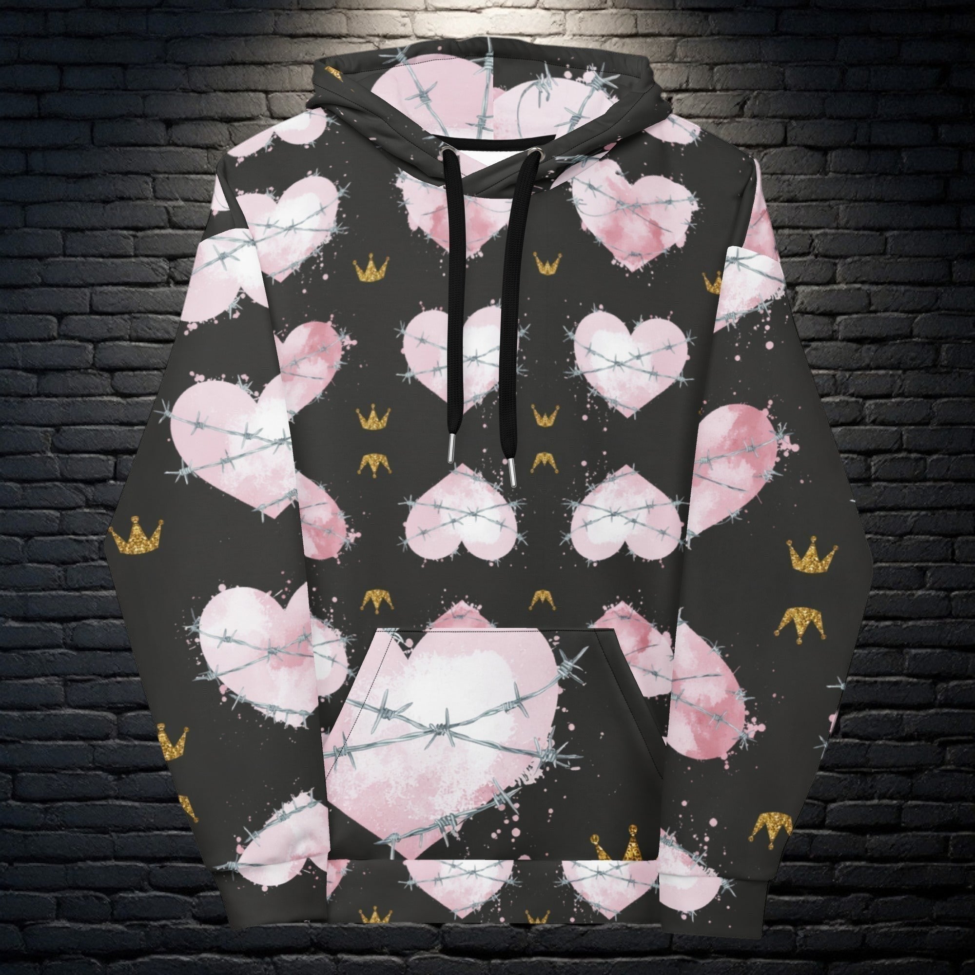 CocoMe Couture Heart of Thorns unisex hoodie with pink heart and barbed wire print on a black background.