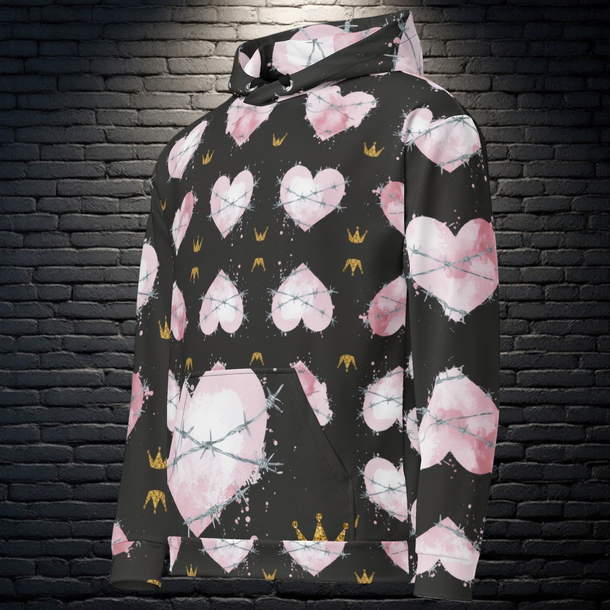 CocoMe Couture Heart of Thorns unisex hoodie in black with pink heart, barbed wire, and gold crown all-over print.