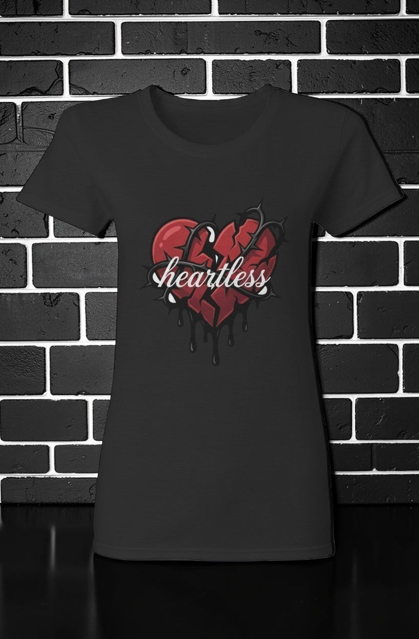CocoMe Couture black heavy cotton tee featuring a red broken heart graphic with thorns and the word Heartless.