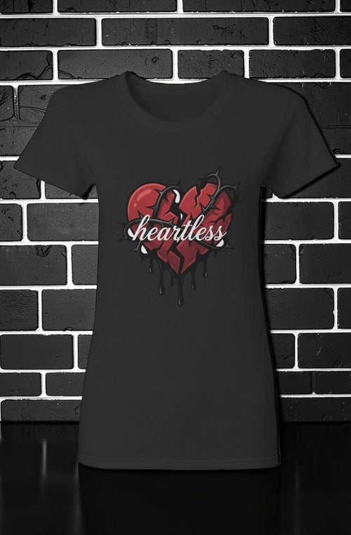 CocoMe Couture black heavy cotton tee featuring a red broken heart graphic with thorns and the word Heartless.