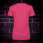 Back view of a plain hot pink CocoMe Couture crewneck t-shirt against a dark brick wall with neon pink lighting.