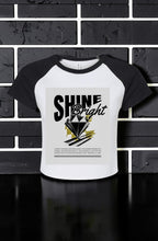Women's Shine Bright Micro Rib Raglan Baby Tee – Cropped Fitted Stretch Shirt styled as a casual fitted graphic tee