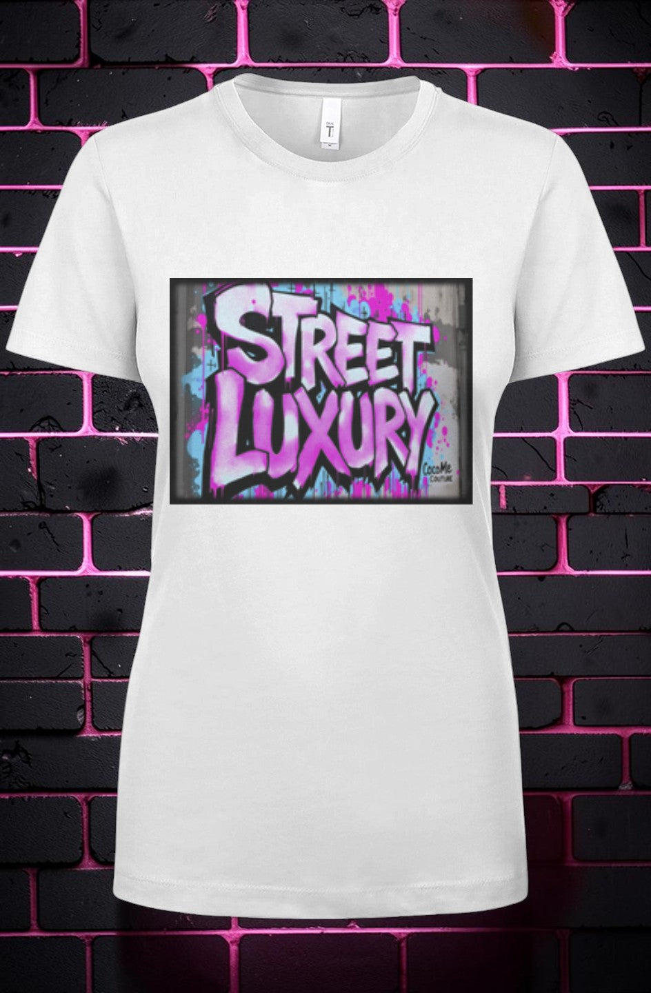CocoMe Couture white crewneck t-shirt featuring a vibrant pink and blue graffiti-style Street Luxury graphic print.