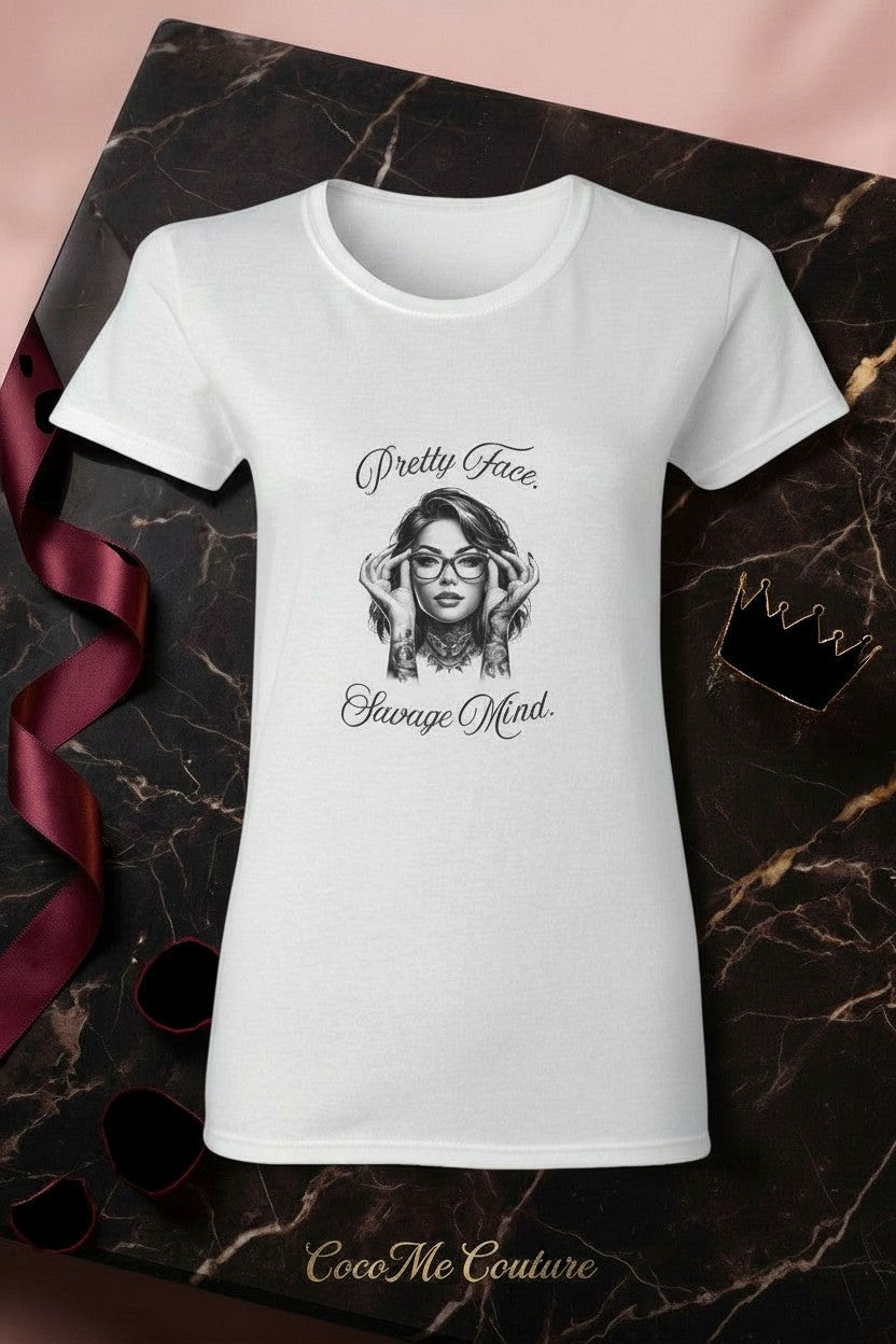 CocoMe Couture white heavy cotton tee featuring a graphic print of a woman with glasses and the text Pretty Face Savage Mind